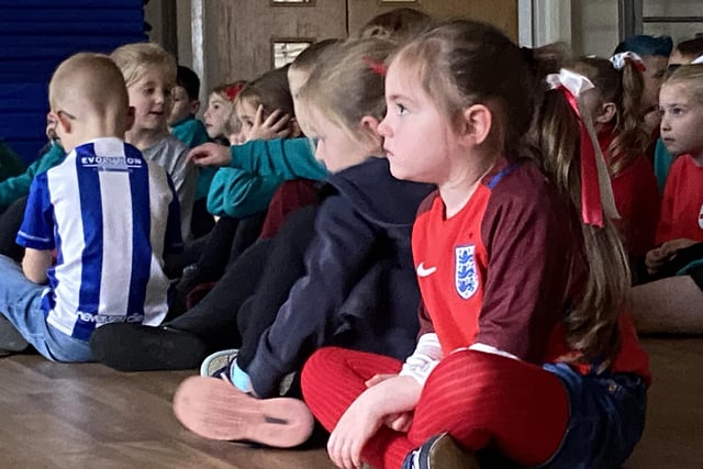 Clavering Primary School pupils watch the game attentively.