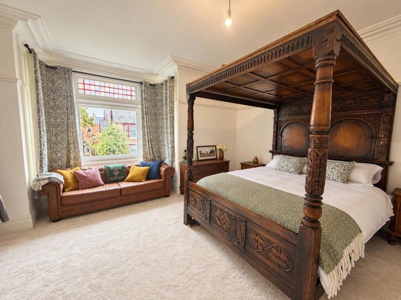 The master bedroom has a feature fireplace and large bay window.