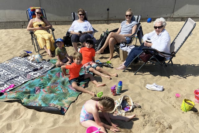 Members of the McHale family taking in the sunny weather at Seaton Carew. Picture by FRANK REID