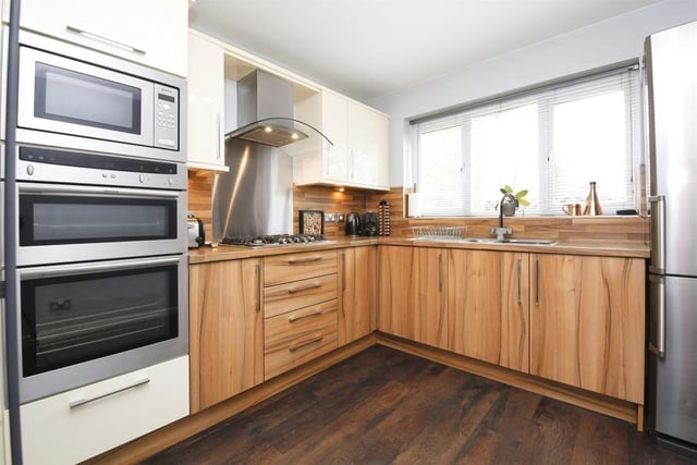 The kitchen has been refitted with a range of units.