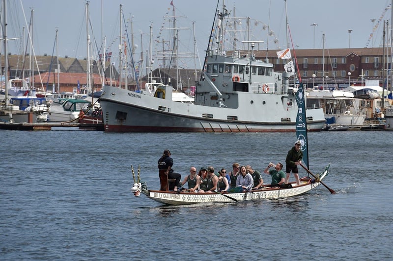 Small ships being rowed around the Marina around the Tall Ships Races on Saturday. Picture by BERNADETTE MALCOLMSON