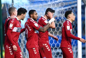 BIRMINGHAM, ENGLAND - DECEMBER 19:  Britt Assombalonga of Middlesbrough  celebrates with Marvin Johnson and teammates after scoring their team's first goal  during the Sky Bet Championship match between Birmingham City and Middlesbrough at St Andrew's Trillion Trophy Stadium on December 19, 2020 in Birmingham, England. The match will be played without fans, behind closed doors as a Covid-19 precaution. (Photo by Laurence Griffiths/Getty Images)