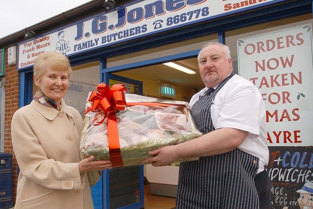 Brenda Breed is handed a hamper from store manager, Barry Varley, of J.G. Jones Butchers, in Wiltshire Way, in 2007.