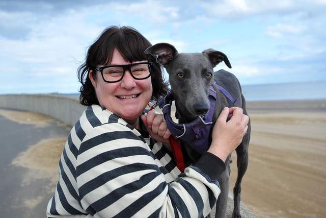 Fred gets a cuddle from his owner Lesley.