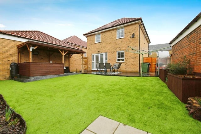 This beautiful house has a large garden featuring gazebo, patio area and decking.