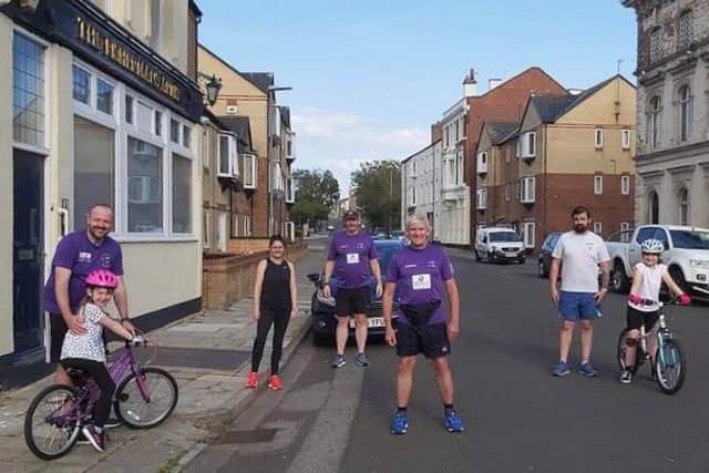 Phil Holbrook (centre) and a socially distanced group doing the summer run last year from the Fisherman’s Arms on the Headland.