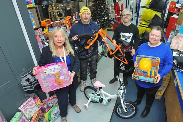 Left to right, Sue Wilson, from Stranton Primary School, Wayne Ingledew, from Ingledew Builders, Lee Dees, from MKM Building Supplies, and Lucy Rowell, from Friends of Stranton Primary School, with just some of the donations to the Mail-backed Christmas appeal at MKM Building Supplies depot, in Burn Road, Hartlepool. Picture by FRANK REID.