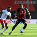 Arnaut Danjuma of AFC Bournemouth controls the ball whilst under pressure from Darnell Fisher of Middlesbrough.