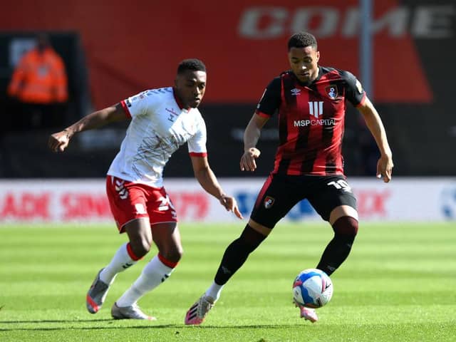 Arnaut Danjuma of AFC Bournemouth controls the ball whilst under pressure from Darnell Fisher of Middlesbrough.