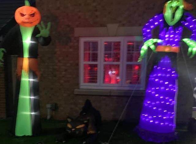 Creepy characters stand guard over this house - stop for a closer look, if you dare!