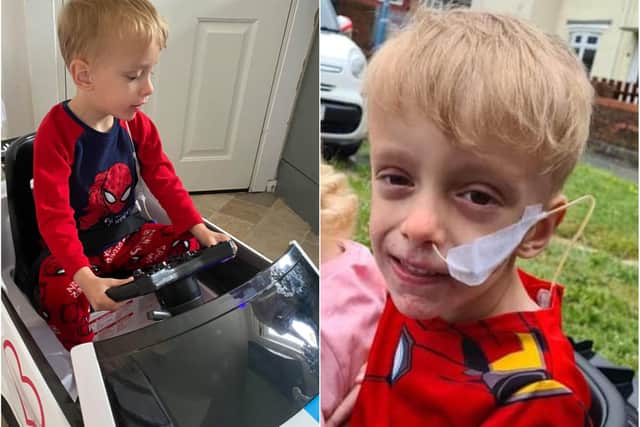 Noah Griffiths who was overjoyed to receive a special present of an electric toy car.