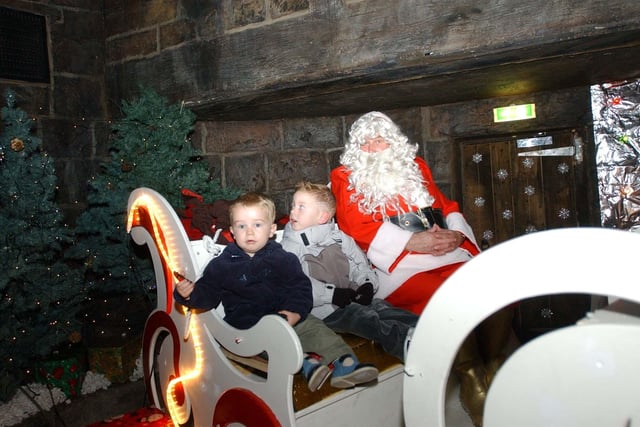 Two little boys join Santa on his sleigh in Hartlepool Historic Quay's grotto from 2003.
