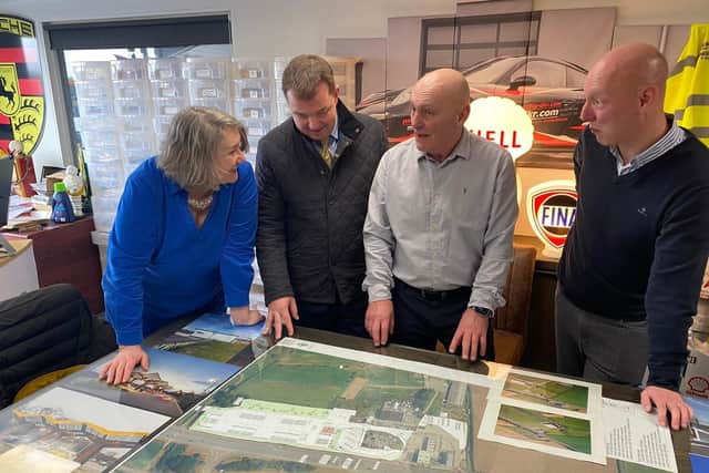 Mrs Mortimer listens to details of plans to expand facilities at Ron Perry & Son.