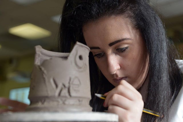 The English Martyrs School and Sixth Form College student Ellie Woolhouse carving her clay shell as part of the Trench Art exhibition.