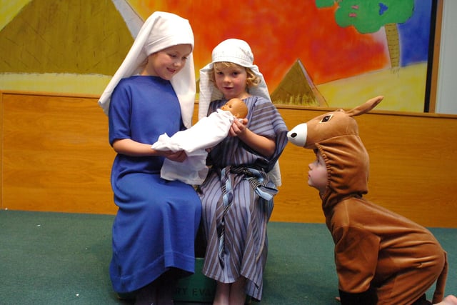 Altogether now. Little donkey ..... starring in the 2011 Nativity were, left to right, Amelia Hammond, Scott Navin and Nathan Walker.