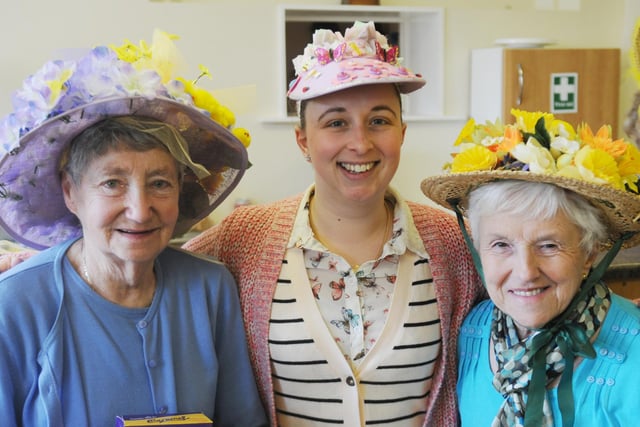 Sarah Barton poses alongside her grandparents Mary Framingham and Rita Barton during Holy Trinity Church of England's Easter bonnet competition in 2013.