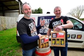 Pat Garrett, left, and Gary Olvanhill from The Crafty Monkey Brewing Company with their three-beer gift sets. Picture by FRANK REID.