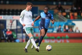 Chris Mepham of AFC Bournemouth in action with Uche Ikpeazu of Wycombe Wanderers.