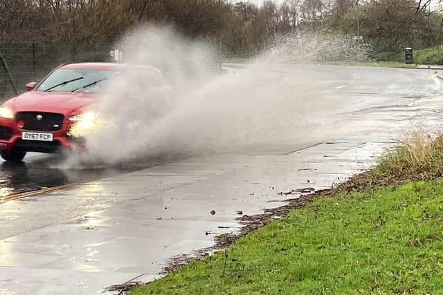 A motorist drives through puddles of water in Cleveland Road, Hartlepool, on Wednesday, December 27. Picture by FRANK REID