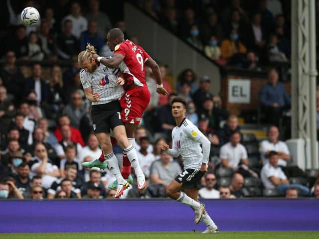 Tim Ream of Fulham is caught by Uche Ikpeazu of Middlesbrough.