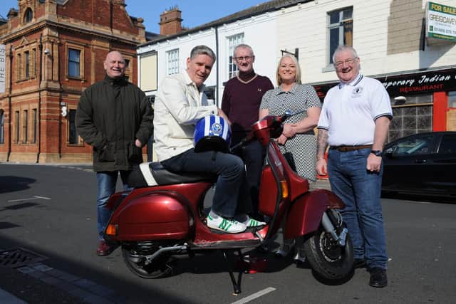 March of the Mod's organiser Kev McGuire, seated on this year big rffle prize, a Vespa scooter,  with Brian Atkinson, Tony Sergeant, Claire Duff and Les Watts.
