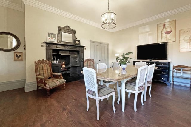 The dining room benefits from a gas feature fireplace with ornate mahogany surround.