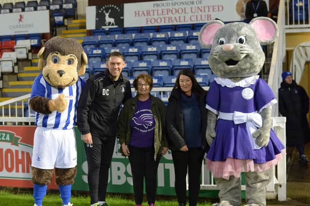 Mascots H’Angus and Alice Mouse with, from left, Pools manager Dave Challiner, and Alice House fundraisers Janice Forbes and Julie Hildreth