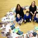 Barnard Grove Primary School staff, from left, Helen Reed and Naomi Tones with pupils Elsie Graham, Samuel Holtham and Charles Bullock with items of art work created by themselves and fellow pupils at the school. Picture by FRANK REID