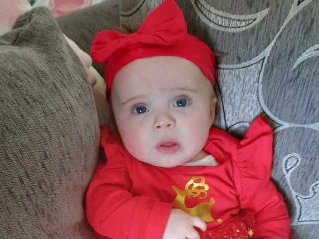 Esmea, age 5 months, ready to celebrate Christmas.