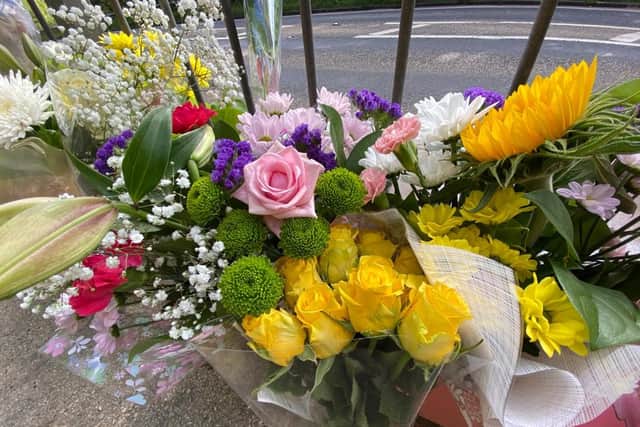 Floral tributes have been left at the scene of the Coast Road crash which has claimed the lives of  two girls, aged 17 and three.