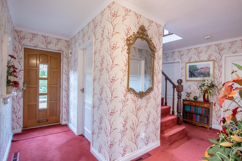 The L-shaped reception hallway offers good storage and access to the utility/cloakroom.