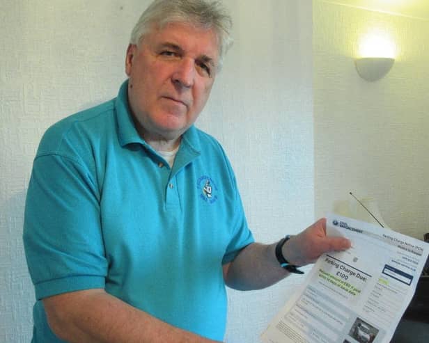 Adrian Beadnell with is parking charge notice.