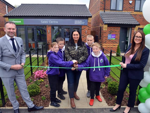 Gemma Lowery unveils the Hardwicke Place Gleeson Homes show house with children from Blackhall Primary School.