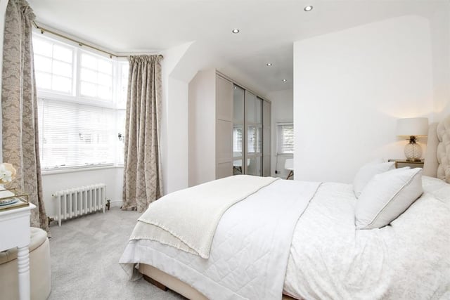 The master bedroom has large fitted wardrobes in the dressing area and en-suite.
