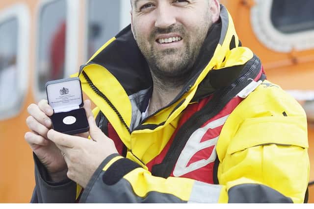 Hartlepool RNLI volunteer Ken Hay pictured with his long service award. Picture by Tom Collins/RNLI