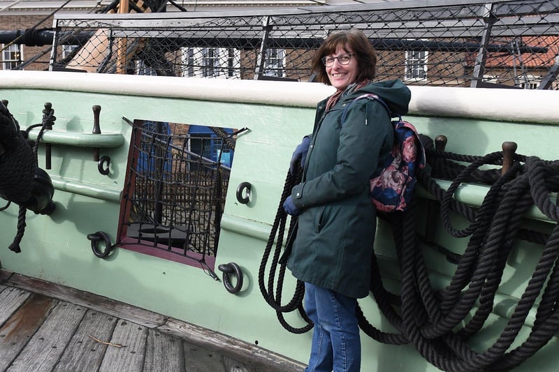 Alison Towers poses for a photo on the HMS Trincomalee at the National Museum of the Royal Navy.