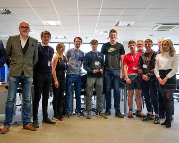 Hartlepool College of Further Education students with their award and challenge supporters including Adrian Wellington Project Architectural Technician, CIOB Chair Tony Bellamy and Victoria Lane from Home Group.