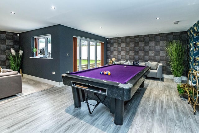 There's space for a pool table in the games room, which opens into the garden.