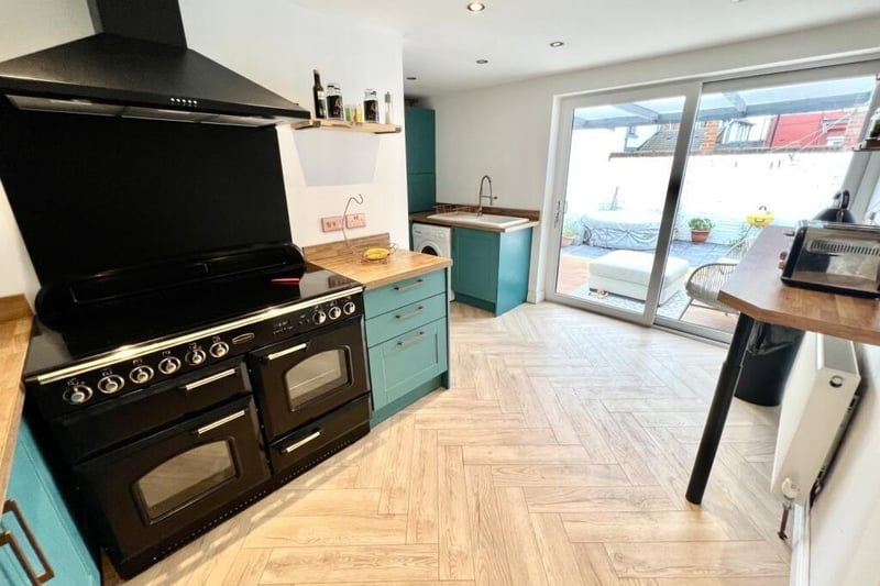 The kitchen has been fitted with a range of units and benefits from a breakfast bar.