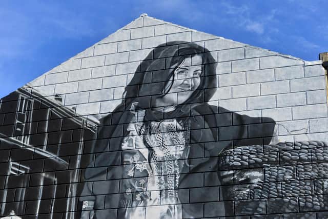 A close up of the woman in the mural.