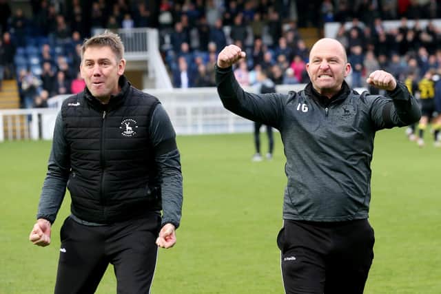 Hartlepool United's Physio Ian "Buster" Gallagher celebrates Hartlepool United manager Dave Challinor after their 3-2 win over Harrogate in his last game for the club during the League Two match between Hartlepool United and Harrogate Town, October 2021. (Credit: Mark Fletcher | MI News)
