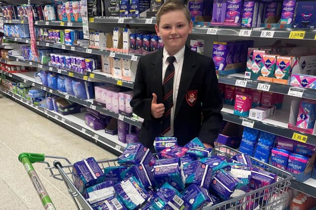 Joel Hogg (11), son of Lyndsay Hogg, with sanitary products ready to take to Hartlepool Uniform Recycling, in Belle Vue Sports Community and Youth Centre, Kendal Road, Hartlepool.
