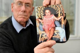 Dad Richie Lee with a photograph of missing Katrice Lee aged 18 months.