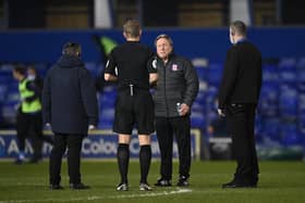 Neil Warnock, manager of Middlesborough, interacts with Match Referee Graham Scott at the half time interval during the Sky Bet Championship match between Coventry City and Middlesbrough at St Andrew's Trillion Trophy Stadium on March 2, 2021.