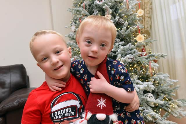 Young carer Zack Baister,7 takes care of his younger brother Toby, 4 who has Downs syndrome.