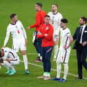 England manager Gareth Southgate (right) is dejected with is players following the penalty shoot out during the UEFA Euro 2020 Final at Wembley Stadium, London. Picture date: Sunday July 11, 2021.