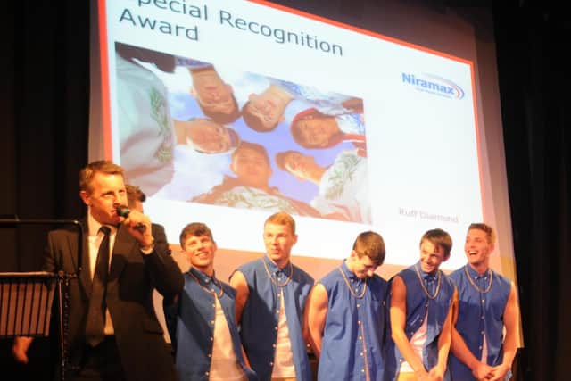 Ruff Diamond, with Lewis pictured second left, collecting their special recognition award at the Hartlepool Mail community awards in 2013.