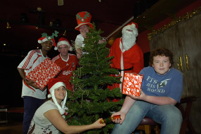 St Luke's Church goers get ready to enjoy their Christmas party in 2009. Pictured are Biruk Tasew, Jon Young, Katy Bell, Noel Brant, Catherine Grasham and Alex Hooks, and Hanyea Mohammed dressed as Santa Claus.