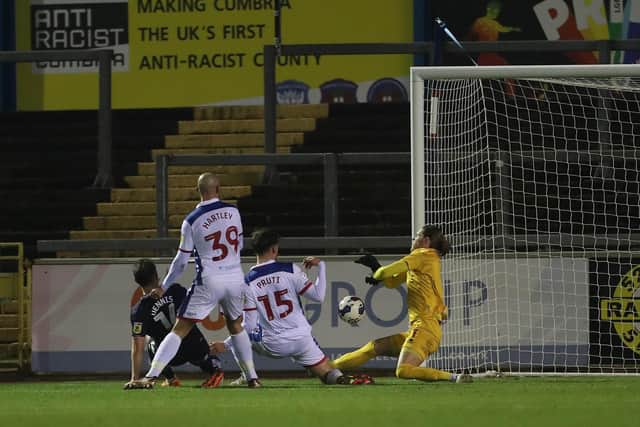 Hartlepool United's Ben Killip makes a save from Carlisle United's Kristian Dennis. (Credit: Mark Fletcher | MI News)