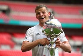 Danny Rowe of AFC Flyde celebrates with the trophy at the end of the FA Trophy Final match between Leyton Orient and AFC Fylde at  Wembley Stadium on May 19, 2019 in London, England. (Photo by Jordan Mansfield/Getty Images)